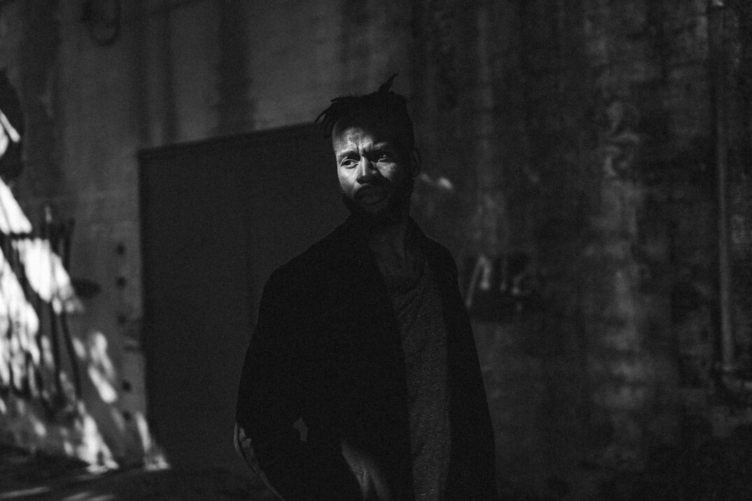 Portrait of a man in a dark suit with a beard