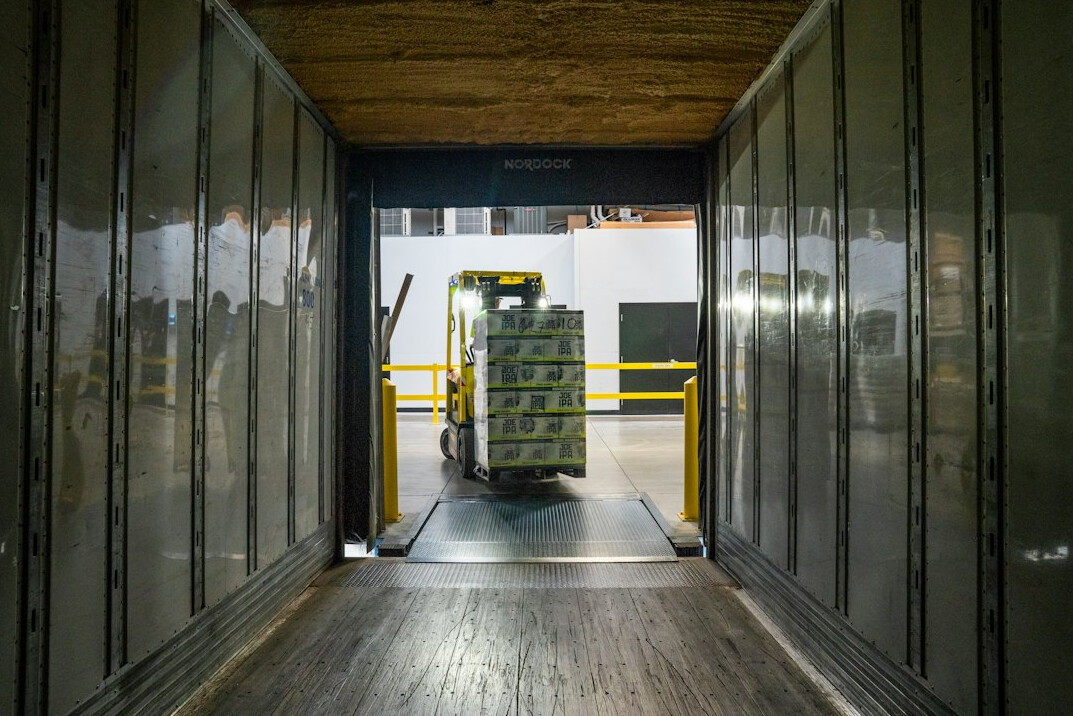Freight truck loading dock with cargo and pallets